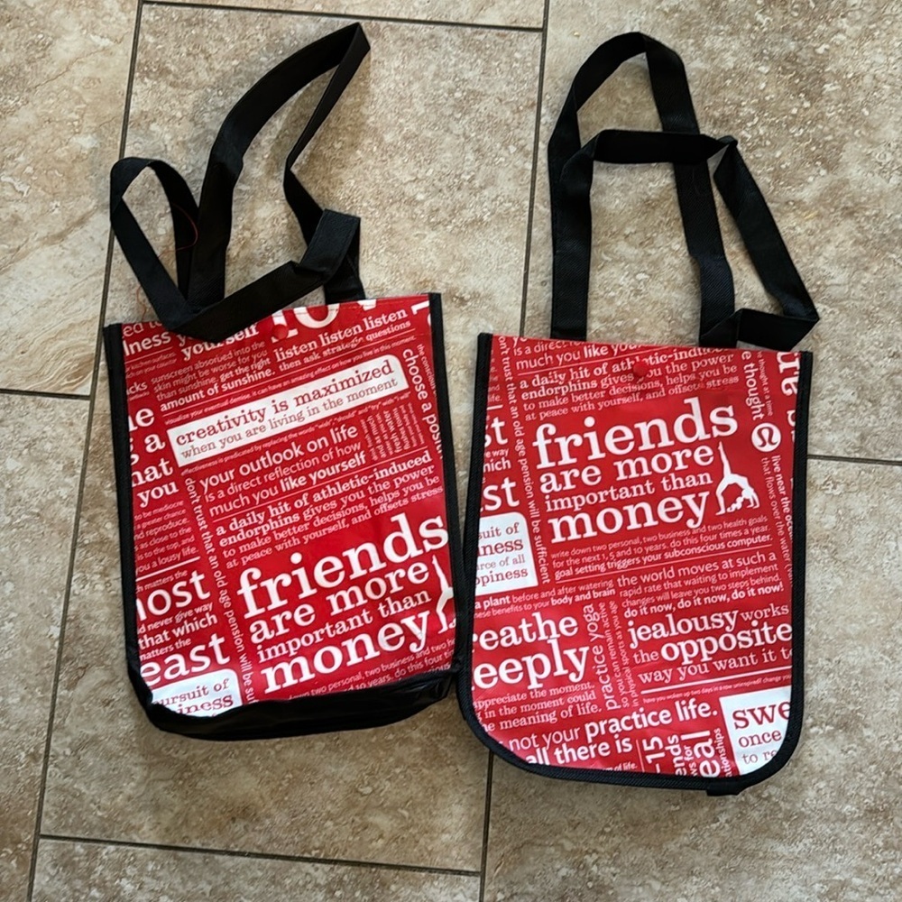 Two (2) red Lululemon‎ snap bags